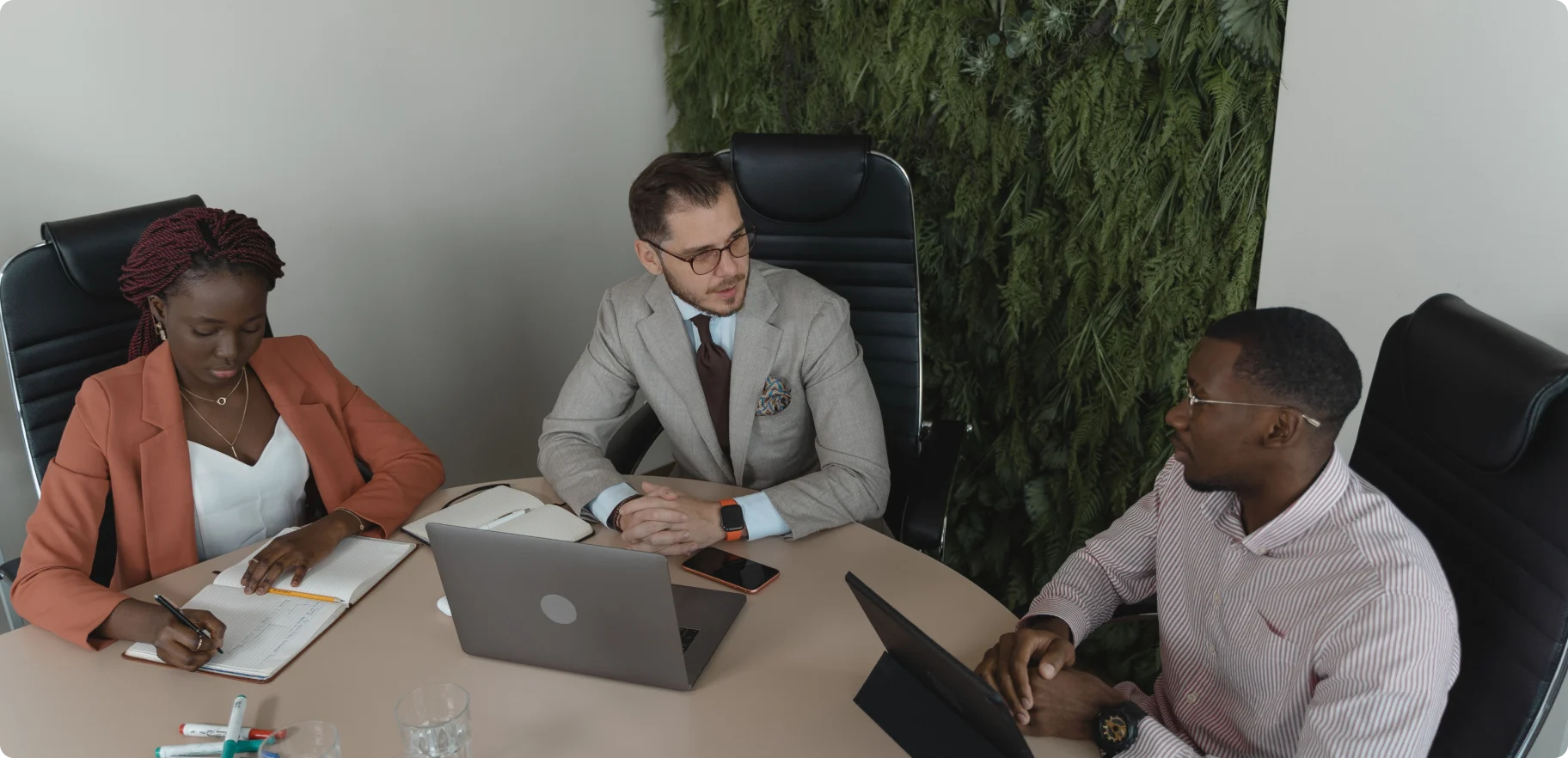 Colleagues working together around a meeting table